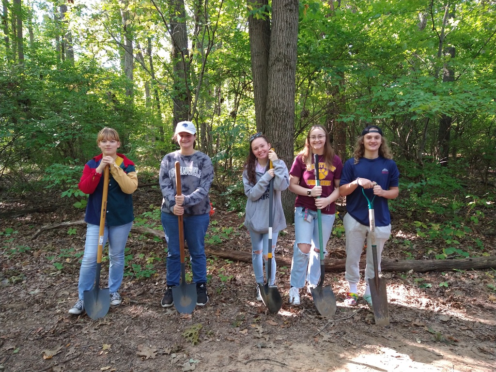 Students cleaning up nature walk